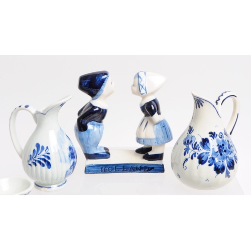 362 - Collection of 20th century Dutch Delft ware pottery pieces. Including boy and girl statues, jugs, be... 