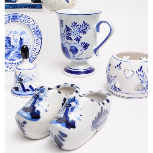 362 - Collection of 20th century Dutch Delft ware pottery pieces. Including boy and girl statues, jugs, be... 