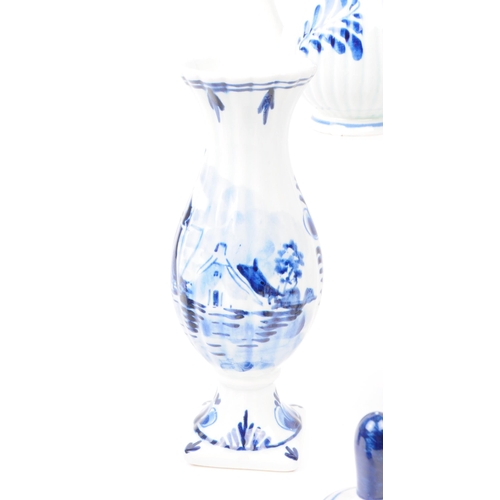 362 - Collection of 20th century Dutch Delft ware pottery pieces. Including boy and girl statues, jugs, be... 