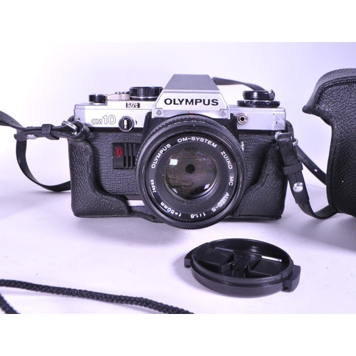 226 - Three late 20th century Olympus film camera and lens. Comprised of the 1979 Olympus OM 10 film camer... 