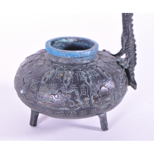 235 - 20th century Chinese bronze dragon statue incense. Features a dragon standing over a squat pot raise... 