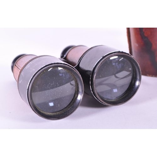 237 - Dollond - Early 20th century London made binoculars x5 2 7/16. Housed within the original leather ca... 