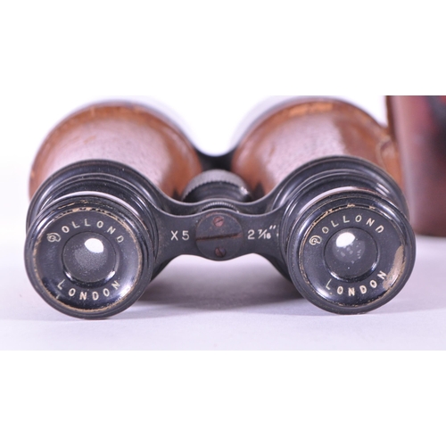 237 - Dollond - Early 20th century London made binoculars x5 2 7/16. Housed within the original leather ca... 