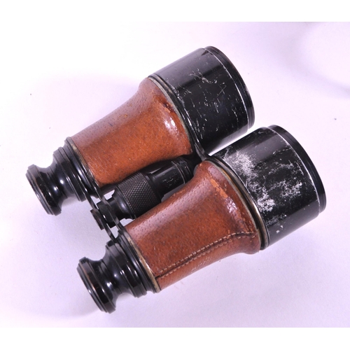 237 - Dollond - Early 20th century London made binoculars x5 2 7/16. Housed within the original leather ca... 