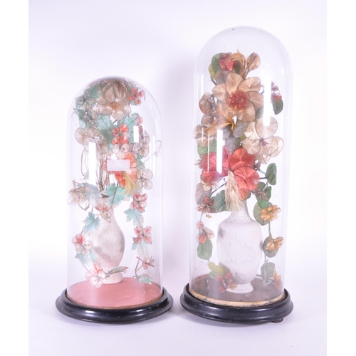 240 - Two late 19th century French globe de mariée wedding glass domes containing bisque porcelain vases w... 