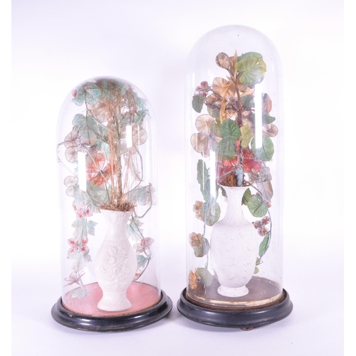 240 - Two late 19th century French globe de mariée wedding glass domes containing bisque porcelain vases w... 