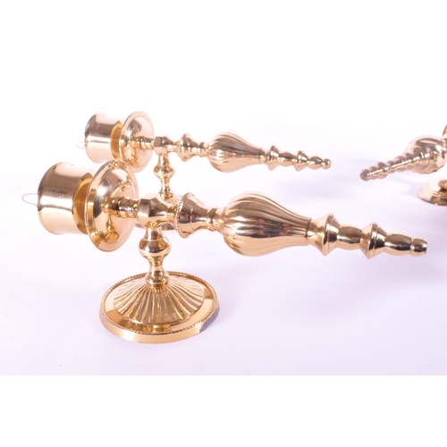 243 - Four 21st century contemporary art deco style brass sconces / wall candlestick holders. Largest meas... 