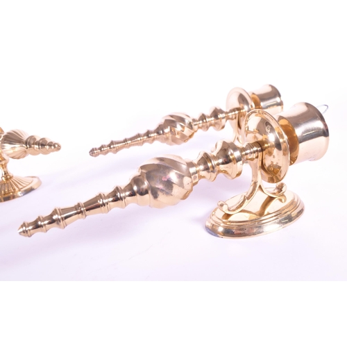 243 - Four 21st century contemporary art deco style brass sconces / wall candlestick holders. Largest meas... 