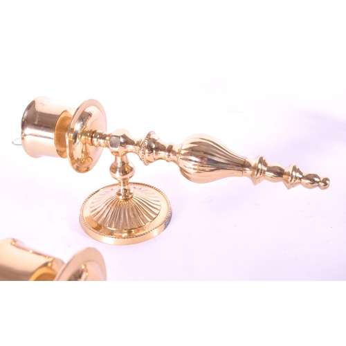 243 - Four 21st century contemporary art deco style brass sconces / wall candlestick holders. Largest meas... 