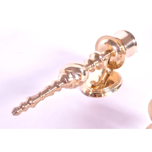 243 - Four 21st century contemporary art deco style brass sconces / wall candlestick holders. Largest meas... 