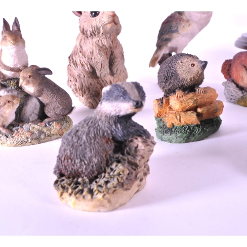 244 - A collection of resin animal figurines / statues. To include rabbits, birds, owls, mice, fox, hedgeh... 