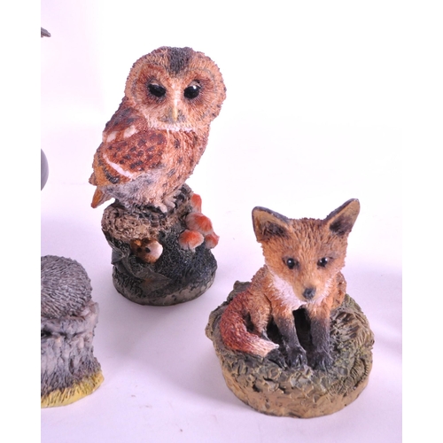 244 - A collection of resin animal figurines / statues. To include rabbits, birds, owls, mice, fox, hedgeh... 