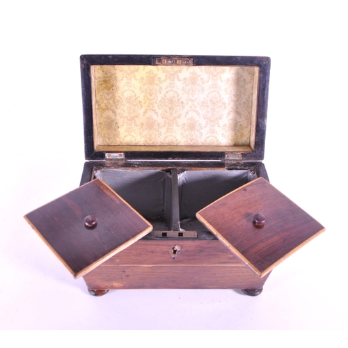 245 - 19th century Victorian walnut sarcophagus tea caddy raised on four bun feet and opening to reveal tw... 