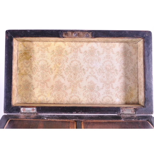 245 - 19th century Victorian walnut sarcophagus tea caddy raised on four bun feet and opening to reveal tw... 