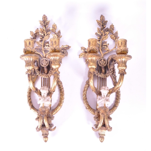 253 - Two late 20th century resin baroque style wall candlestick holders / sconces. Each featured with two... 