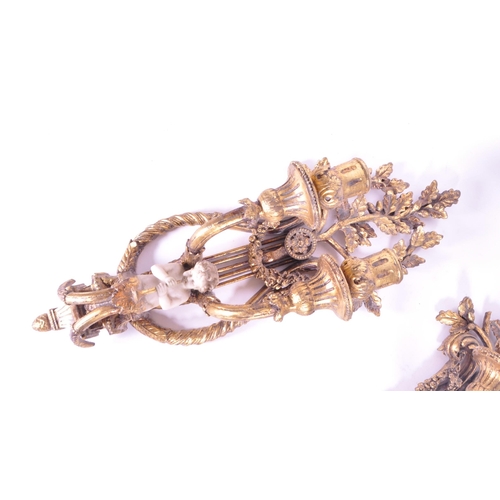 253 - Two late 20th century resin baroque style wall candlestick holders / sconces. Each featured with two... 