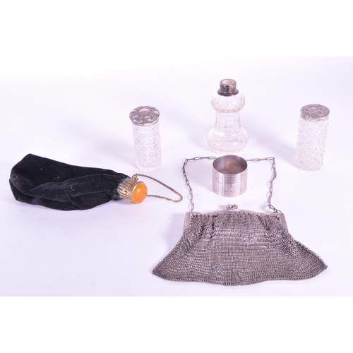 255 - Collection of early 20th century hallmarked silver pieces, comprised of a napkin ring, chain clutch ... 