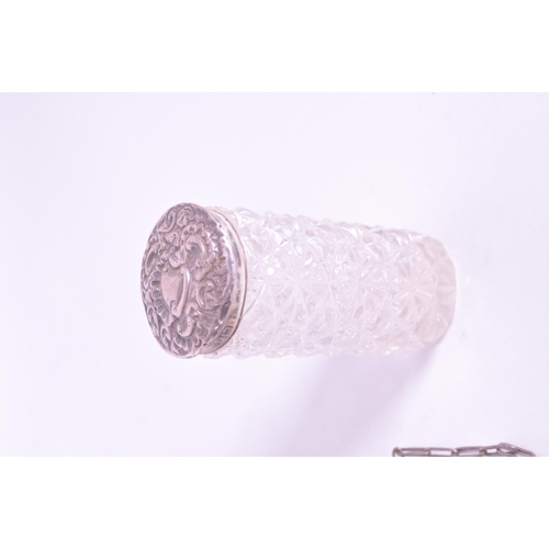 255 - Collection of early 20th century hallmarked silver pieces, comprised of a napkin ring, chain clutch ... 