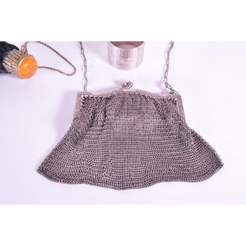 255 - Collection of early 20th century hallmarked silver pieces, comprised of a napkin ring, chain clutch ... 