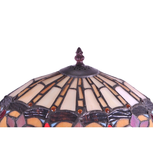 256 - A 20th century Tiffany style table lamp. The lamp featuring a plinth style base with fluted gadroone... 