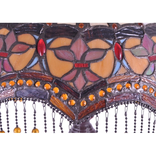 256 - A 20th century Tiffany style table lamp. The lamp featuring a plinth style base with fluted gadroone... 