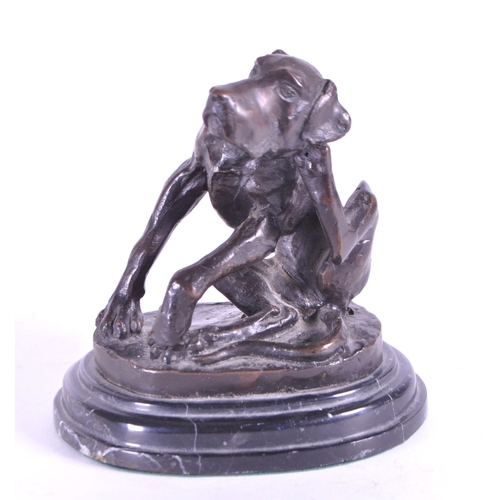 259 - After Christopher Fratin - A 20th century cast bronze hound figure. The dog sat scratching upon a na... 