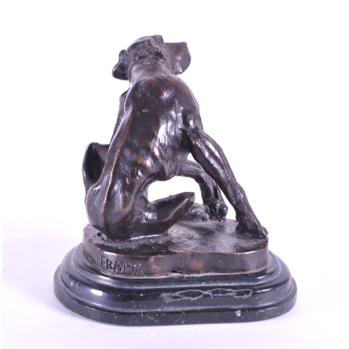 259 - After Christopher Fratin - A 20th century cast bronze hound figure. The dog sat scratching upon a na... 