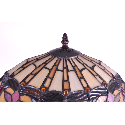 260 - A 20th century Tiffany style table lamp. The lamp featuring a plinth style base with fluted gadroone... 