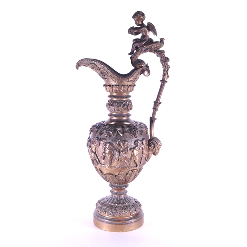 263 - A large 19th century French ormolu and bronze type ewer, the scroll handle surmounted by a cherub an... 