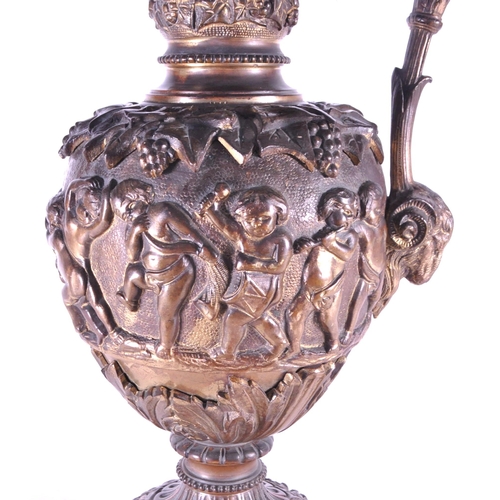 263 - A large 19th century French ormolu and bronze type ewer, the scroll handle surmounted by a cherub an... 