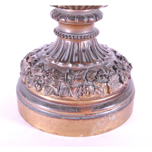 263 - A large 19th century French ormolu and bronze type ewer, the scroll handle surmounted by a cherub an... 