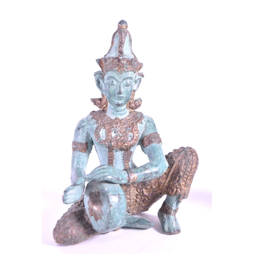 265 - Two 20th century bronze Thai Buddha temple figures. In traditional clothing with one playing drum th... 