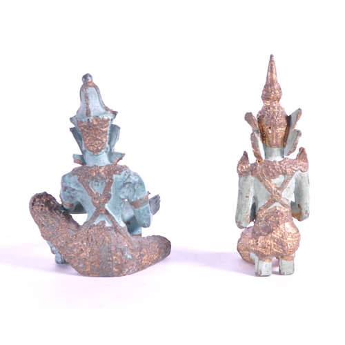 265 - Two 20th century bronze Thai Buddha temple figures. In traditional clothing with one playing drum th... 
