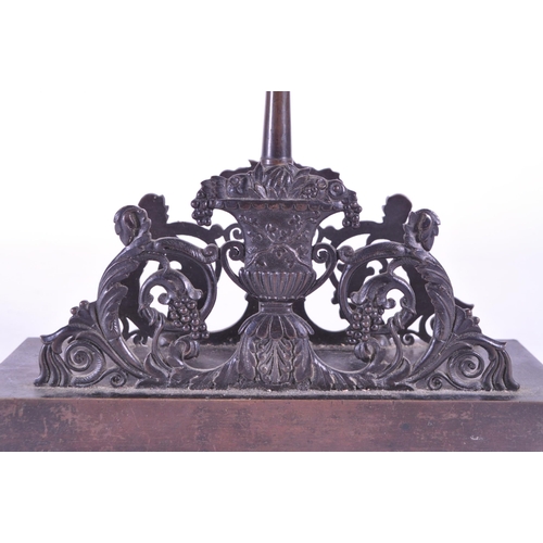 270 - A 19th century bronze letter magazine rack / desk tidy. Neoclassical design with acorn finial to cen... 