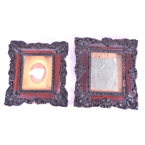 271 - A pair of 19th century carved wooden carved frames. With an ebonised carved scrolled edge, central g... 