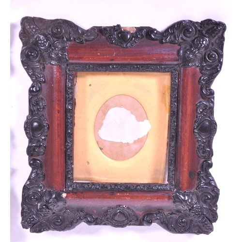 271 - A pair of 19th century carved wooden carved frames. With an ebonised carved scrolled edge, central g... 