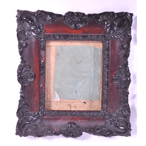 271 - A pair of 19th century carved wooden carved frames. With an ebonised carved scrolled edge, central g... 