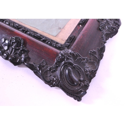 271 - A pair of 19th century carved wooden carved frames. With an ebonised carved scrolled edge, central g... 