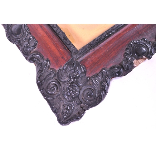271 - A pair of 19th century carved wooden carved frames. With an ebonised carved scrolled edge, central g... 