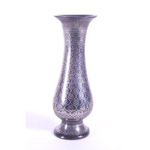272 - A vintage 20th century metal etched stem bud vase. With flared top into a tapering neck and tulip fo... 