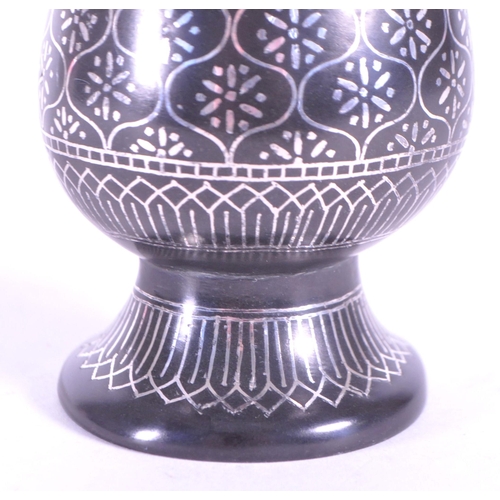 272 - A vintage 20th century metal etched stem bud vase. With flared top into a tapering neck and tulip fo... 