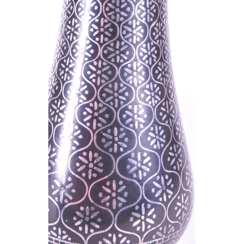 272 - A vintage 20th century metal etched stem bud vase. With flared top into a tapering neck and tulip fo... 