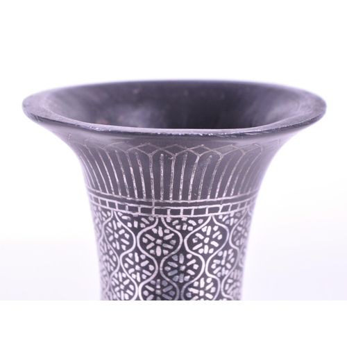 272 - A vintage 20th century metal etched stem bud vase. With flared top into a tapering neck and tulip fo... 