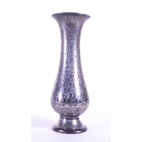 272 - A vintage 20th century metal etched stem bud vase. With flared top into a tapering neck and tulip fo... 