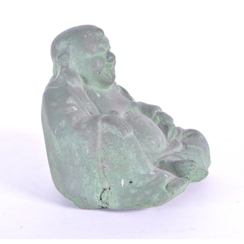 273 - An early 20th century metal Chinese laughing Buddha, Hotei. Patinaed throughout in a seated position... 