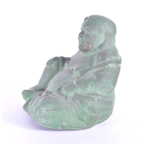 273 - An early 20th century metal Chinese laughing Buddha, Hotei. Patinaed throughout in a seated position... 