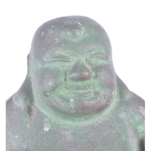 273 - An early 20th century metal Chinese laughing Buddha, Hotei. Patinaed throughout in a seated position... 