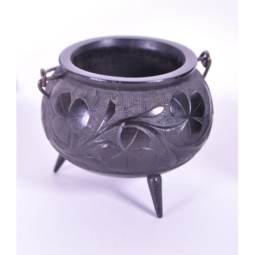 278 - Collection of four 20th century Irish carved ebony bog oak figures comprised of two cauldrons and tw... 