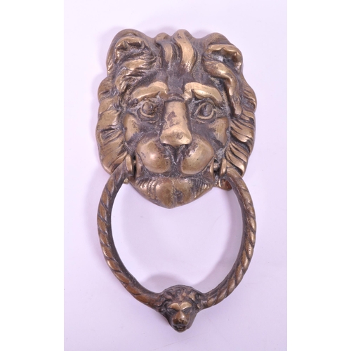 280 - A 19th century Victorian lion brass door knocker. Featuring a lion's head with ring knocker with ano... 