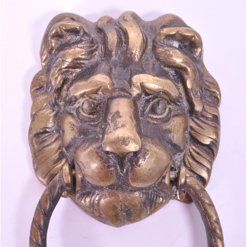 280 - A 19th century Victorian lion brass door knocker. Featuring a lion's head with ring knocker with ano... 